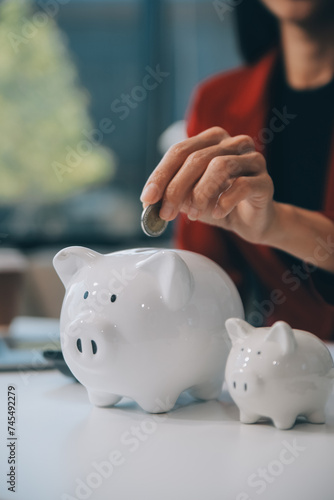 Businesswoman save money in piggy bank and goal and achievement chart graph and arrows. Funds loans and Investment profits. Concept of saving for insurance, health, education, house, car, tax, loan