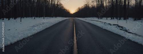 Panoramic view of a concrete road in the middle of a forest at winter sunset from Generative AI