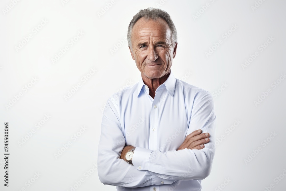 Portrait of senior man with arms crossed. Isolated on white background. Portrait of senior man with arms crossed. Isolated on white background.