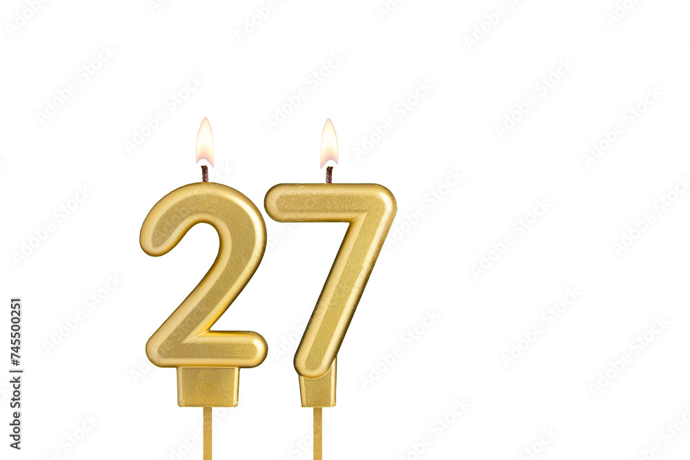 Golden number 27 birthday candle on white background Golden number 27 birthday candle on white background