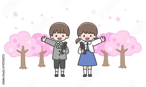 卒園式　桜の前に並んで立つ男の子と女の子