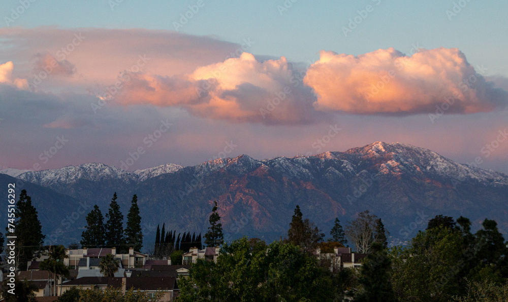 Snowy mountaintops at sunset