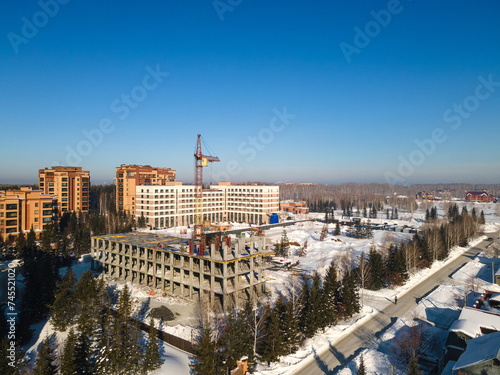 Photography the construction site of an apartment building in the winter from a height
