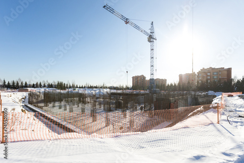 Photography the construction site of an apartment building in the winter from a height