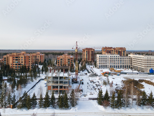 Photography the construction site of an apartment building in the winter from a height