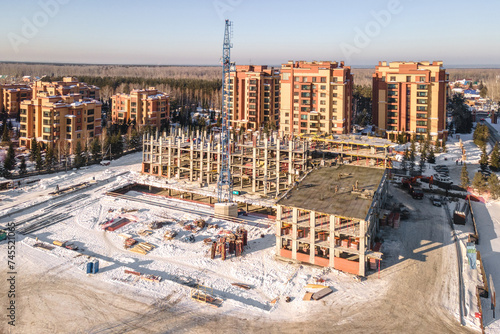 Photography the construction site of an apartment building in the winter from a height
