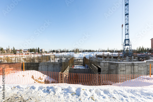 Photography the construction site of an apartment building in the winter from a height