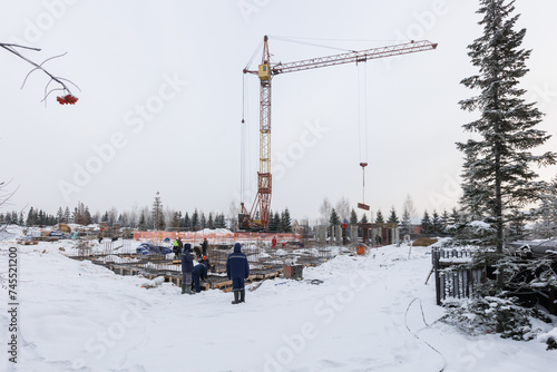 Photography the construction site of an apartment building in the winter from a height