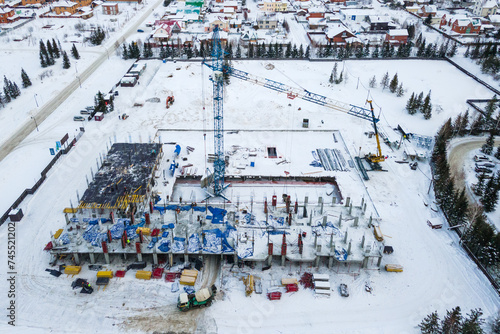Photography the construction site of an apartment building in the winter from a height