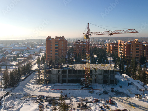Photography the construction site of an apartment building in the winter from a height