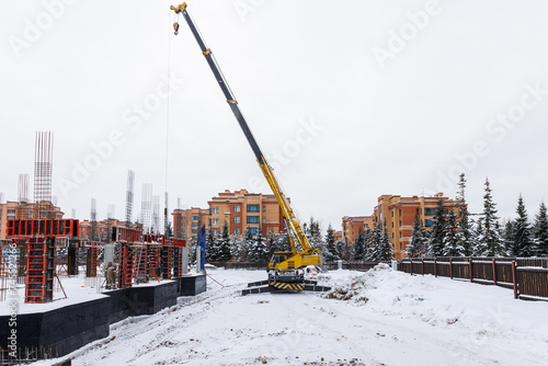 Photography the construction site of an apartment building in the winter from a height
