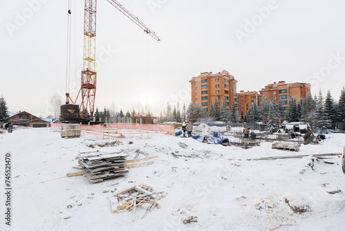 Photography the construction site of an apartment building in the winter from a height