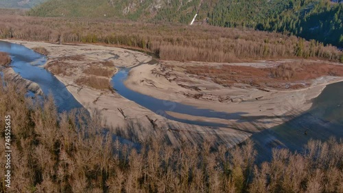 River, Riverbank and Trees in Canadian Nature Landscape Background. Aerial View. Squamish Valley, British Columbia, Canada. photo