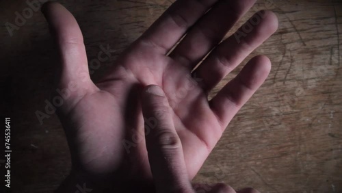 Detailed view of palm lines for palmistry on rustic wooden background photo