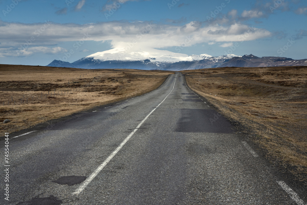 Scenic country road towards beautiful Snaefellsjokull glacier in the west of Iceland during midday