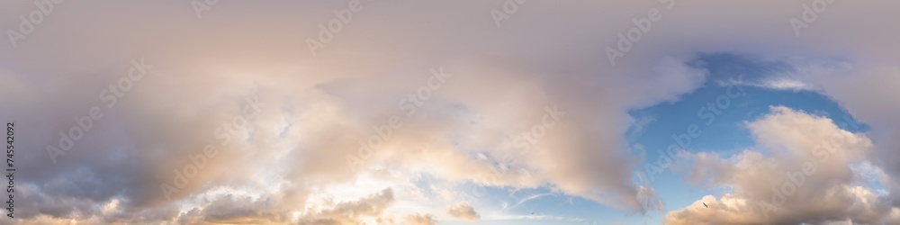Sunset sky panorama with glowing golden Cumulus clouds. Seamless hdr 360 panorama in spherical equirectangular format. Full zenith for 3D visualization, sky replacement for aerial drone panoramas