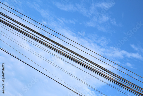 blue-sky electricity with awesome clouds at morning-afternoon. Electric wire, viewed over blue sky.