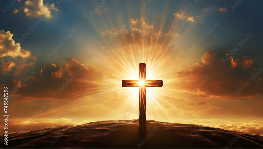 Fototapeta premium Silhouette of shining cross symbol on top mountain with sunset background.