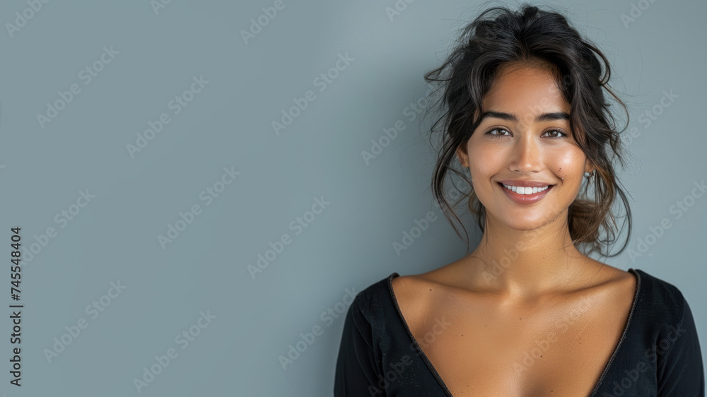 Indian woman wearing black ribbed V-Neck Body smiling isolated on grey Indian woman wearing black ribbed V-Neck Body smiling isolated on grey