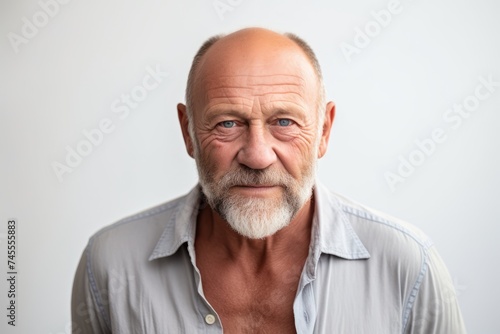 Portrait of a senior man with grey hair. Isolated on white background.