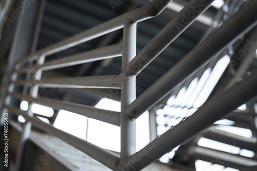 Metal overpass platform with banister structure of the factory place. Industrial building part. Close-up and selective focus. photo