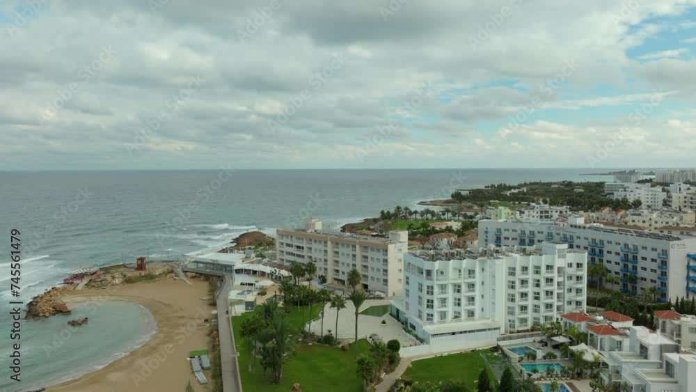 Aerial Rising Above Empty Pernera P Beach and Pola Costa Beach Hotel Apts on Cloudy Day in Paralimni City, Cyprus Aerial Rising Above Empty Pernera P Beach and Pola Costa Beach Hotel Apts on Cloudy Day in Paralimni City, Cyprus