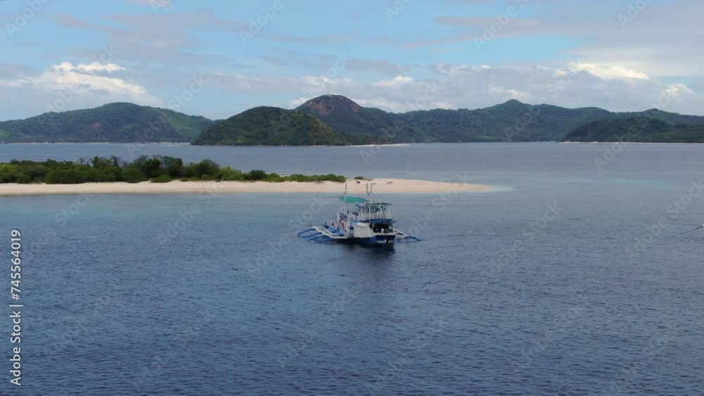 Tipycal touristic boats between El Nido and Coron Island, Palawan area, Philippines. Aerial orbiting and space for copy Tipycal touristic boats between El Nido and Coron Island, Palawan area, Philippines. Aerial orbiting and space for copy