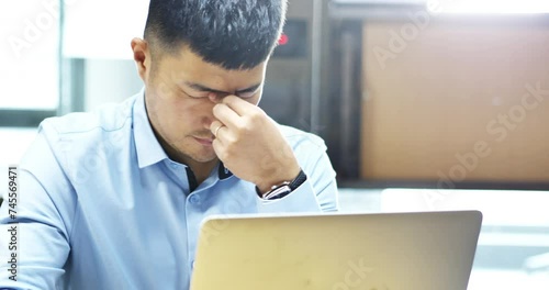 person feeling tired in office photo