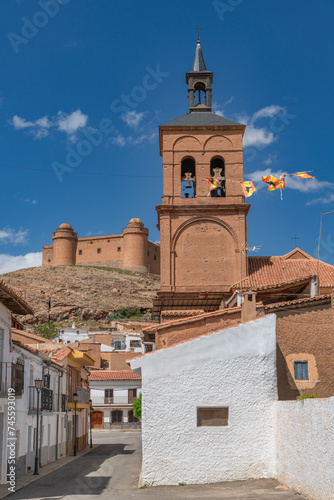 The village La Calahorra, in the province of Granada, Spain with Castillo de La Calahorra on top of hill. It is situated in the Sierra Nevada foothills.
