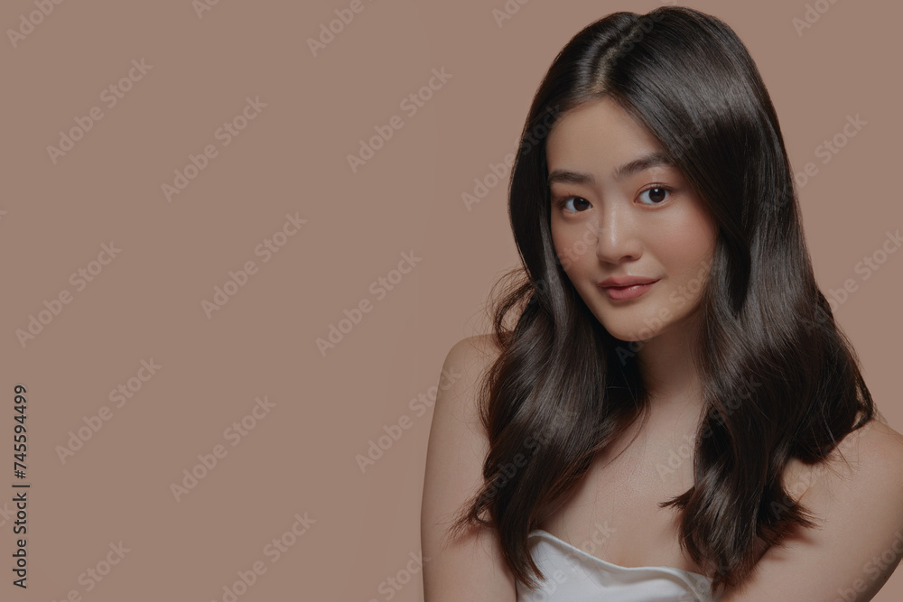 Beautiful young asian woman with clean and smooth fresh skin on beige background. Face care, Facial treatment, Cosmetology, beauty and spa, Asian women portrait. Beautiful young asian woman with clean and smooth fresh skin on beige background. Face care, Facial treatment, Cosmetology, beauty and spa, Asian women portrait.