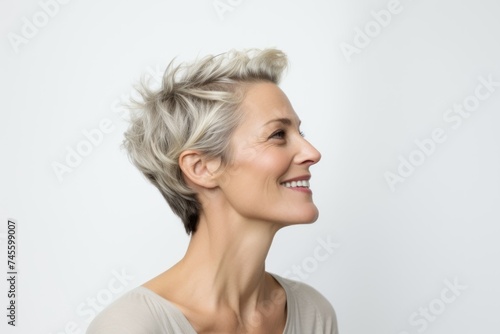 Portrait of a happy middle-aged woman with short gray hair