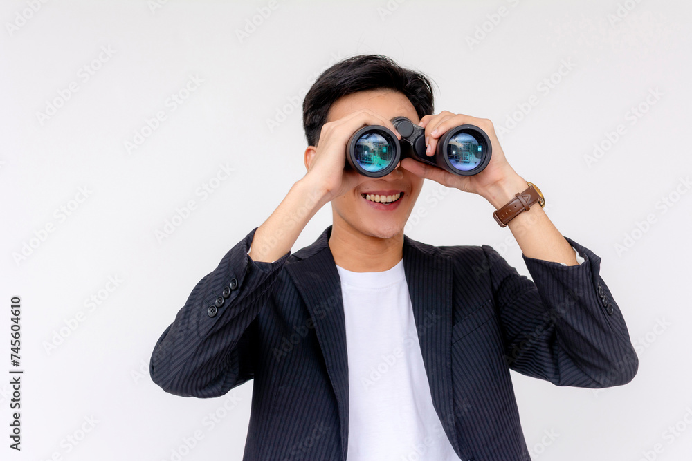 A cheerful young man using binoculars and smiling, depicted over a clean white background, illustrating exploration or surveillance. A cheerful young man using binoculars and smiling, depicted over a clean white background, illustrating exploration or surveillance.