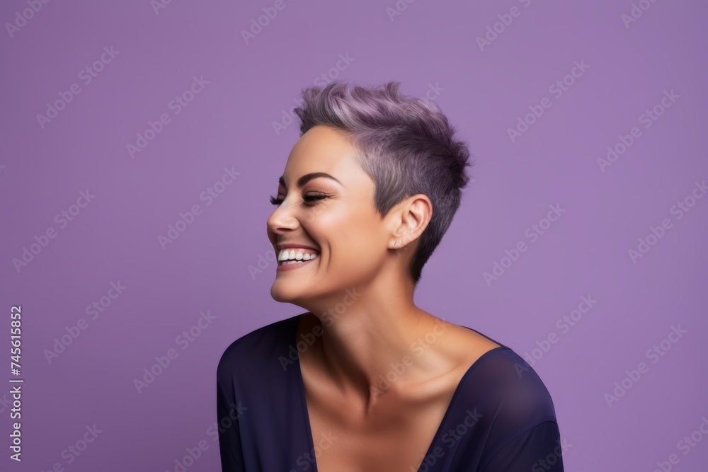 Beauty portrait of smiling woman with short purple hair. Portrait of beautiful young woman with trendy hairstyle.