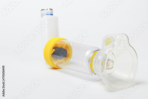 Fotografija closeup of a spacer, asthma inhaler isolated on white background and copy space