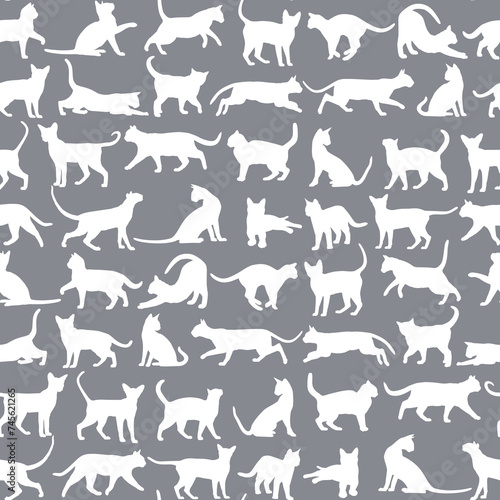 Seamless blue background with silhouettes of cats.