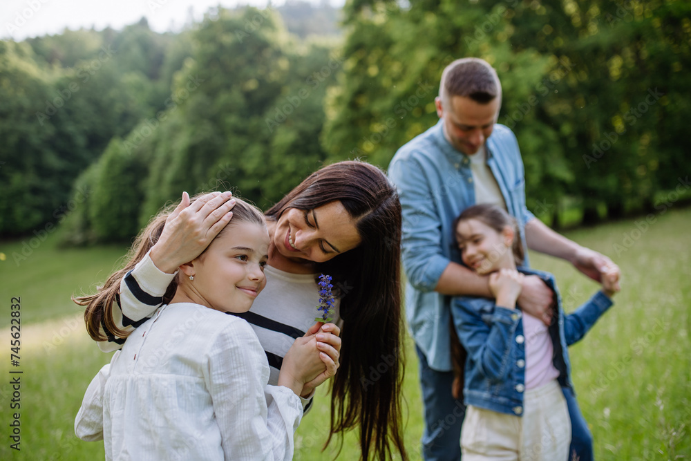 Beautfiul young family at meadow, enjoying together time. Beautfiul young family at meadow, enjoying together time.