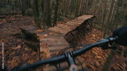 Mountain Bike Park Skills Balancing Over Wood Obstacle