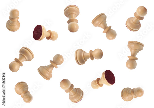 Wooden chess pawns falling on white background