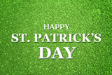 Happy St. Patrick's day card. Text and green shiny glitter