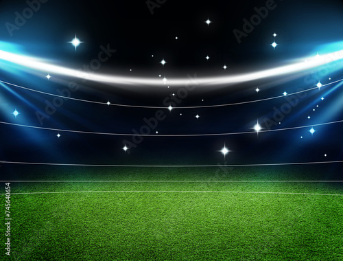 Empty green sports field under stadium lights