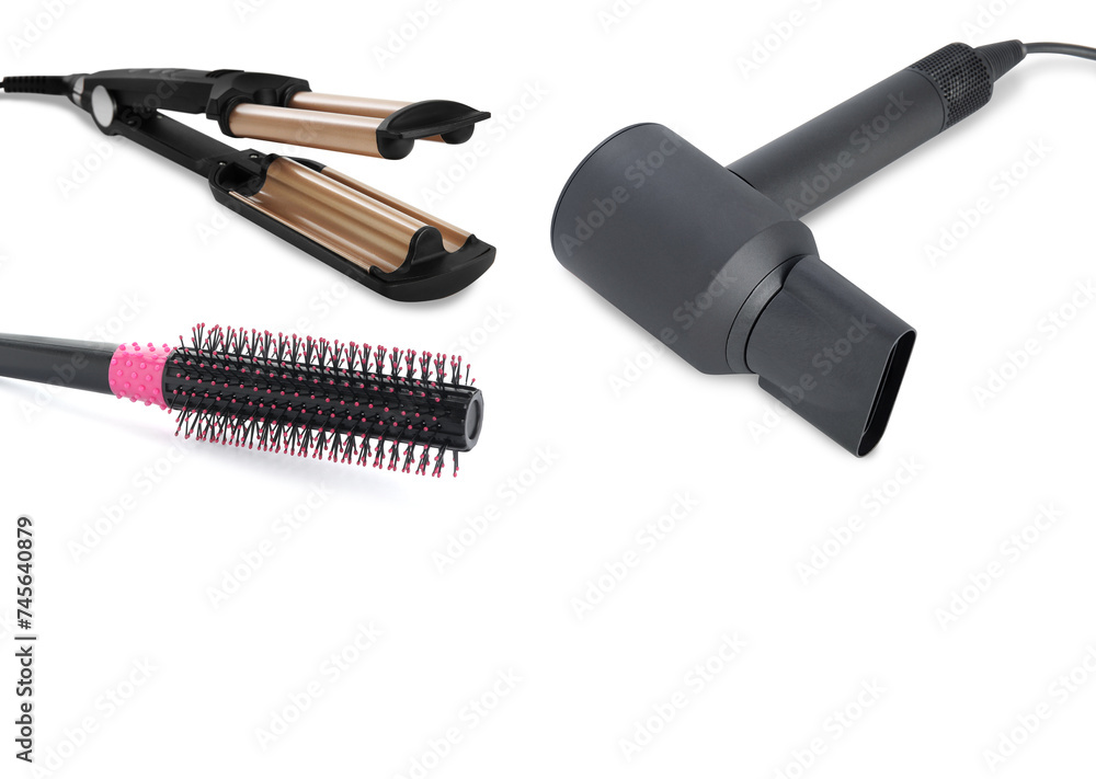 Hair dryer, triple curling iron and round brush on white background Hair dryer, triple curling iron and round brush on white background