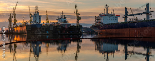 Ship repair at the ship repair yard during a spectacular sunrise-panorama