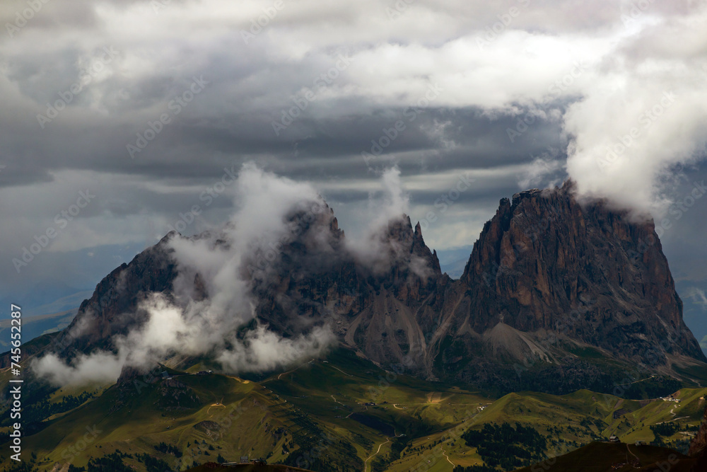 Summer mist over the three peaks of the Sassolungo (Langkofel) in the Dolomites, Italy.