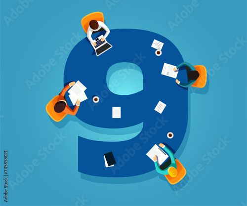 Number 9. Team works together at a table in the shape of the number nine. Creative font.