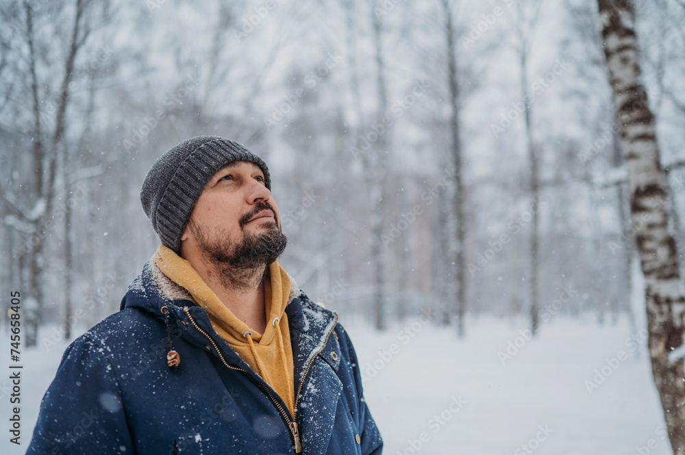 Mature man wearing warm clothes at park Mature man wearing warm clothes at park