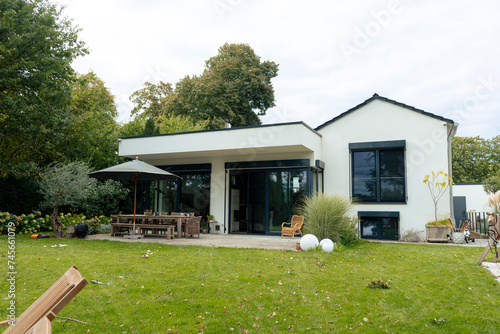 Modern house with garden under sky photo