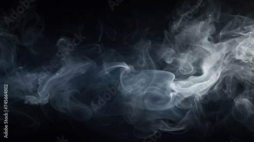 Abstract smoke of white color on a dark background. An atmosphere of mystery and magic. The texture of steam and smoke.