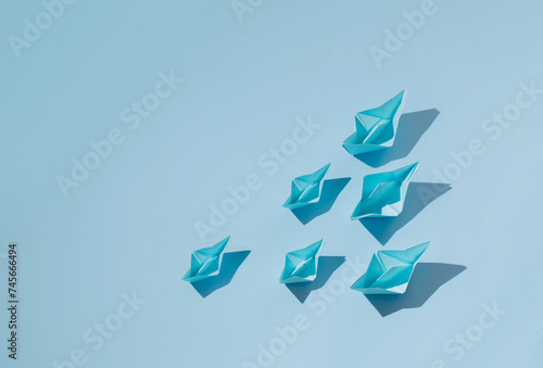 blue paper boats on blue background