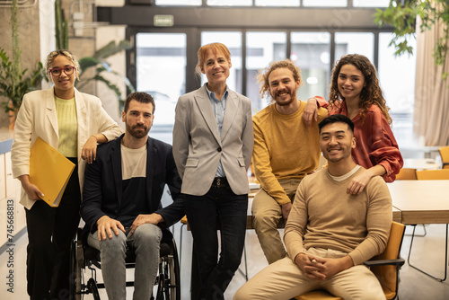 Smiling diverse business colleagues in workplace