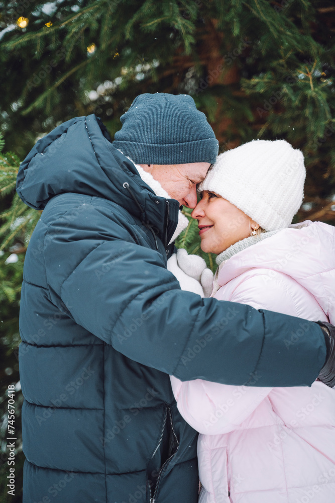 Romantic mature couple face to face in winter Romantic mature couple face to face in winter